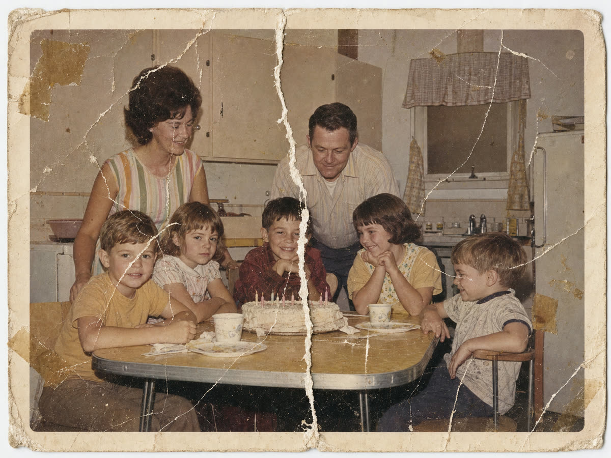 Torn family table photo repaired with PhotoScanRestore before